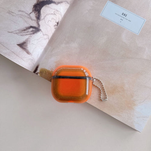 Molten Orange square hair clip on a textured surface with a blurred background